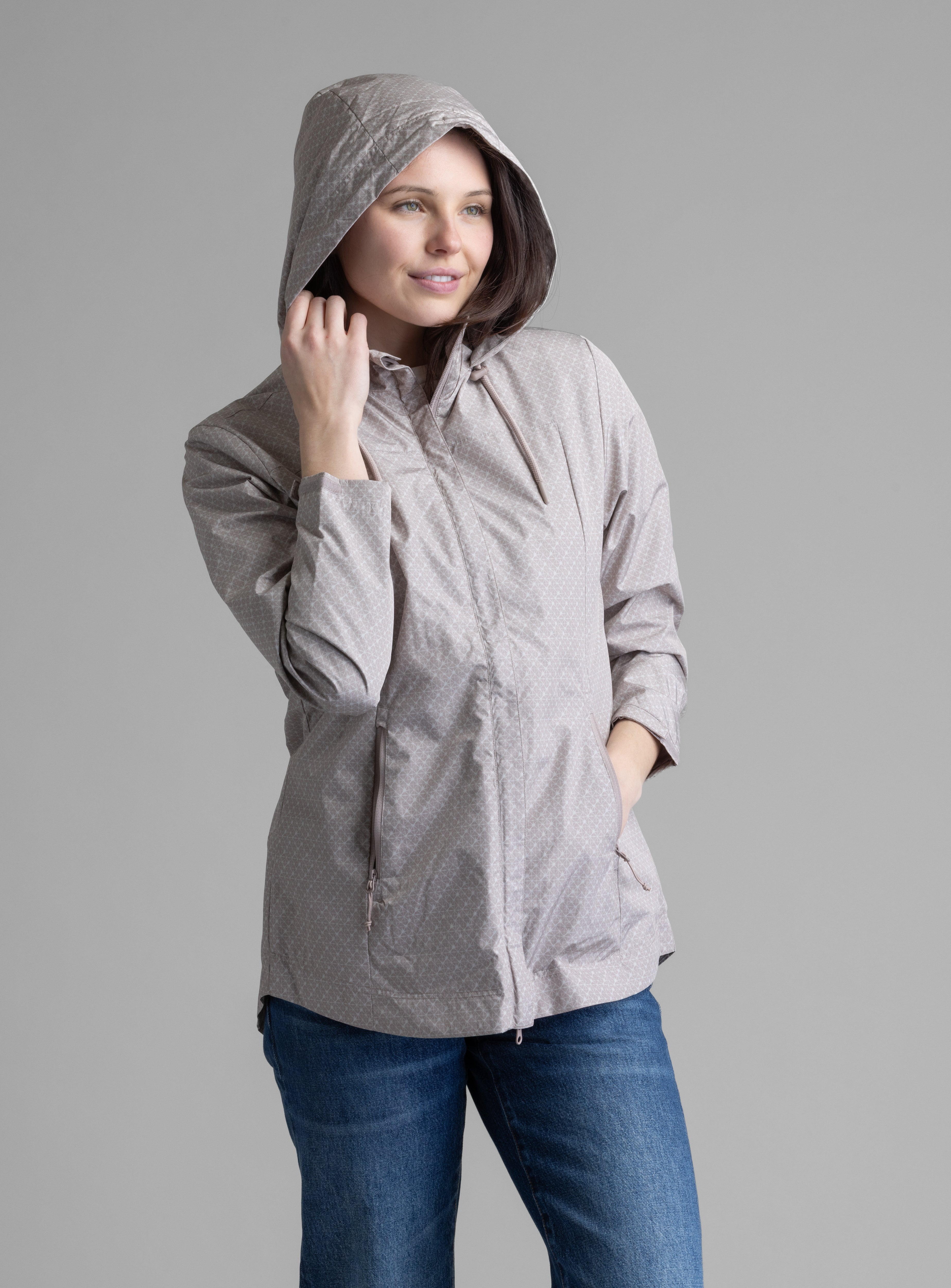 Women's LIV Outdoor Savannah fleece-lined rainshell jacket with waterproof fabric and adjustable hood, ideal for rainy weather.