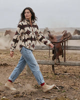Women's LIV Outdoor Ainsley Sherpa Pullover in cozy, cream-colored sherpa fabric, showcasing its soft, warm interior and casual style.