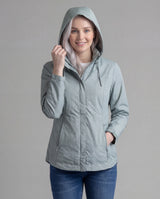 Women's LIV Outdoor Savannah fleece-lined rainshell jacket in aqua gray, shown front view with hood and waterproof material.