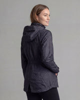 Black LIV Outdoor Women's Savannah fleece-lined rainshell jacket displayed from the back, showcasing its waterproof design and cozy fleece lining.