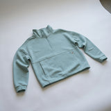 Women's LIV Outdoor Kaya quilted pullover in aqua grey, featuring a quarter-zip and cozy padded design.