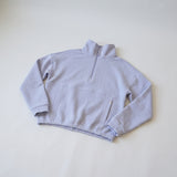 Women's LIV Outdoor Kaya quilted pullover with quarter-zip in Icelandic Blue, showcasing a cozy, stylish top for outdoor wear.