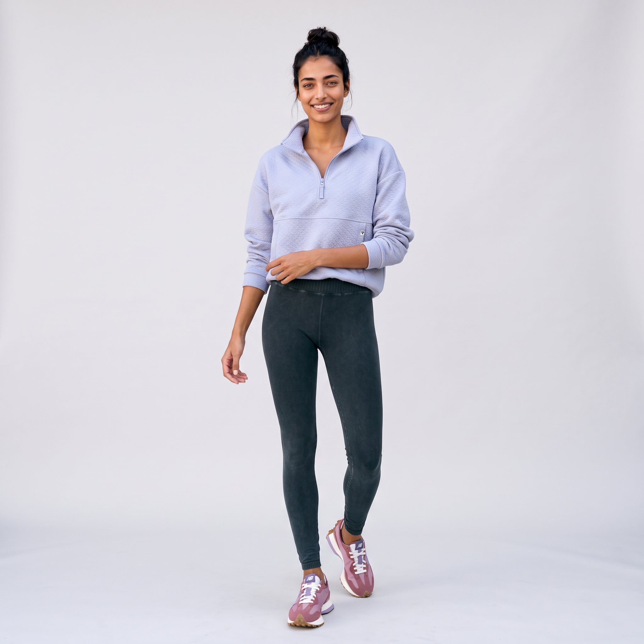 Women's LIV Outdoor Kaya quilted pullover with quarter-zip in Icelandic Blue, showcasing a cozy, stylish top for outdoor wear.