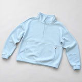 Women's LIV Outdoor Kaya quilted pullover in illusion blue, featuring a quarter-zip style and cozy quilted fabric.