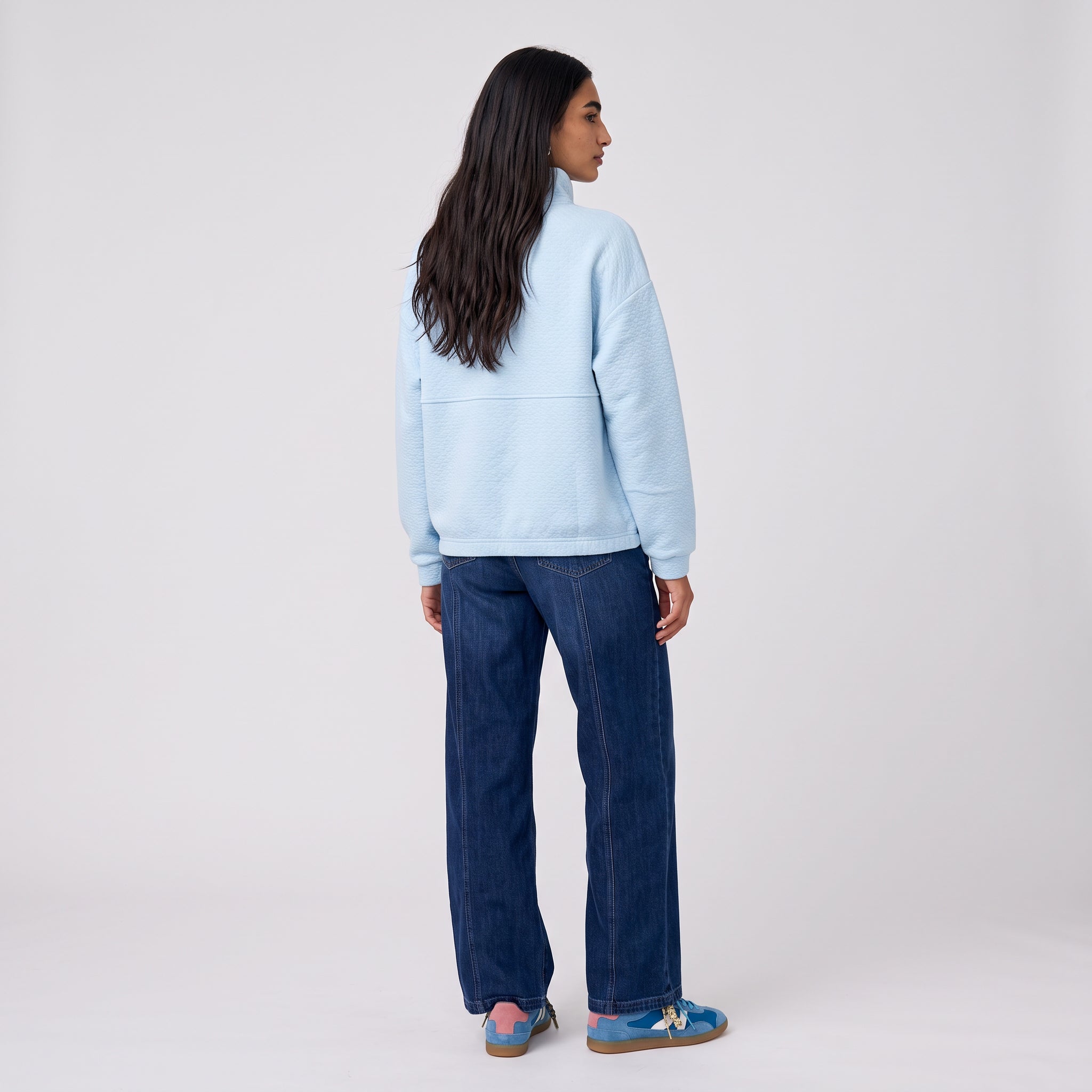Women's LIV Outdoor Kaya quilted pullover with quarter-zip closure in illusion blue, featuring quilted design and cozy fit.
