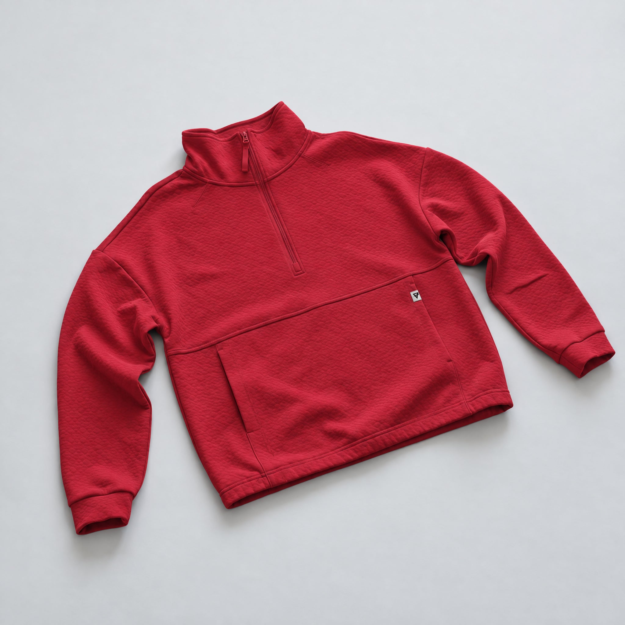 Women's LIV Outdoor Kaya quilted pullover with quarter zip in vibrant scarlet, showcased on a flat front view.