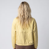 Women's LIV Outdoor Kaya quilted pullover with quarter-zip, shown in a stylish, cozy top on a light background.