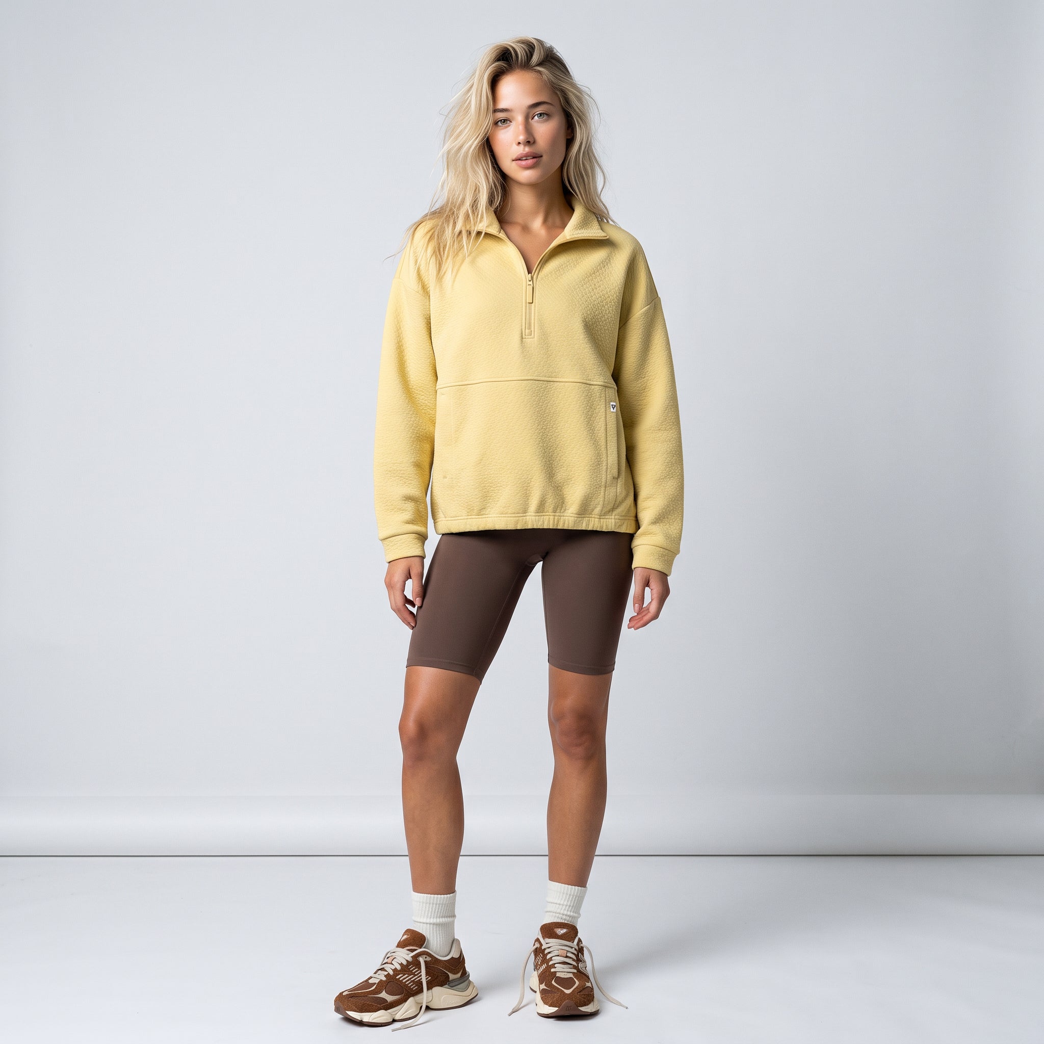 Women's LIV Outdoor Kaya quilted pullover with quarter-zip, showcasing its stylish design and cozy fit.