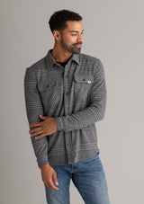Men's LIV Outdoor Lichen Stretch Flannel Button Down shirt, featuring a plaid pattern and classic collar, displayed on a hanger.
