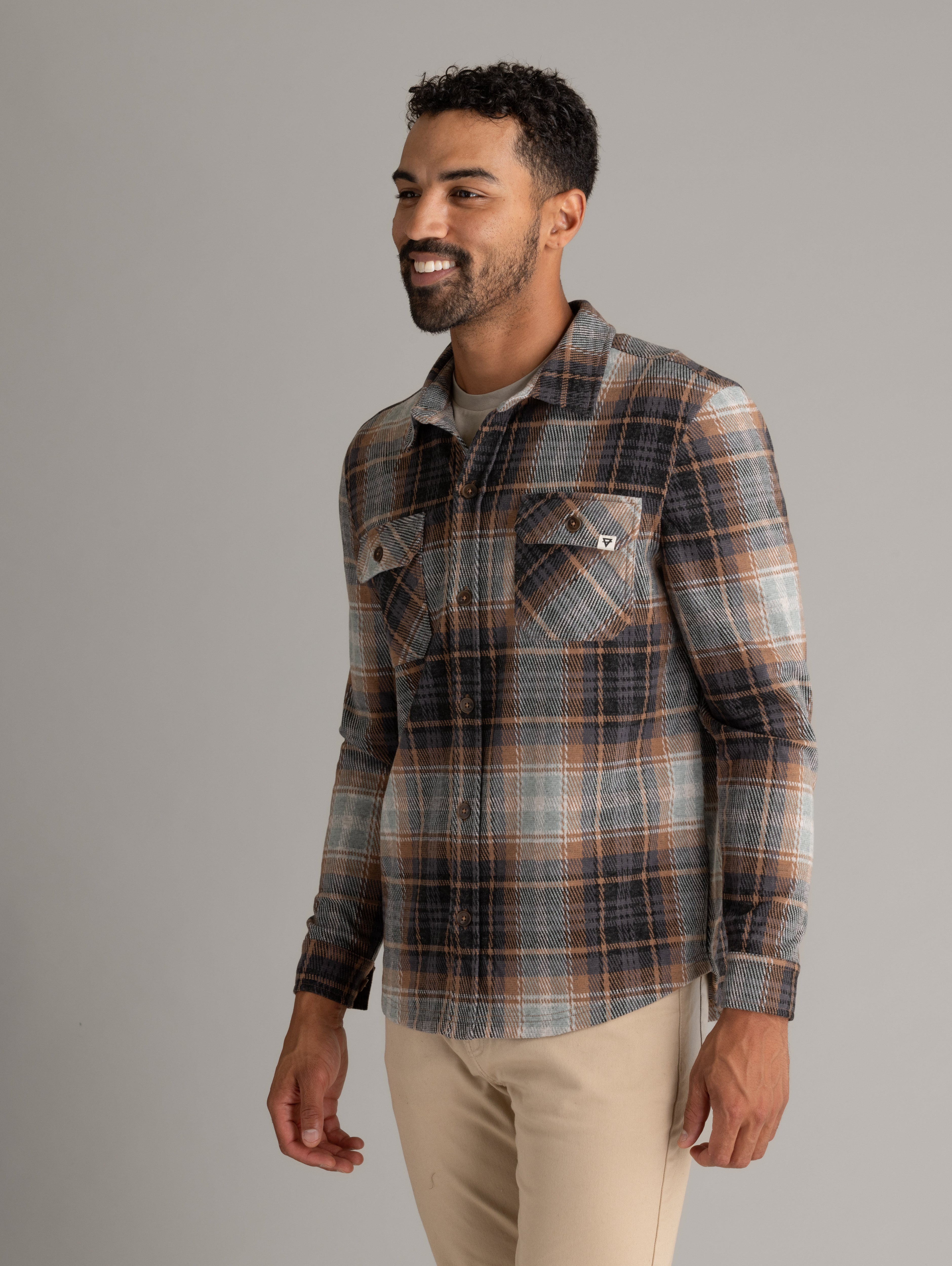 Men's LIV Outdoor Lichen Stretch Flannel Button Down shirt, front view showing plaid pattern and button details.