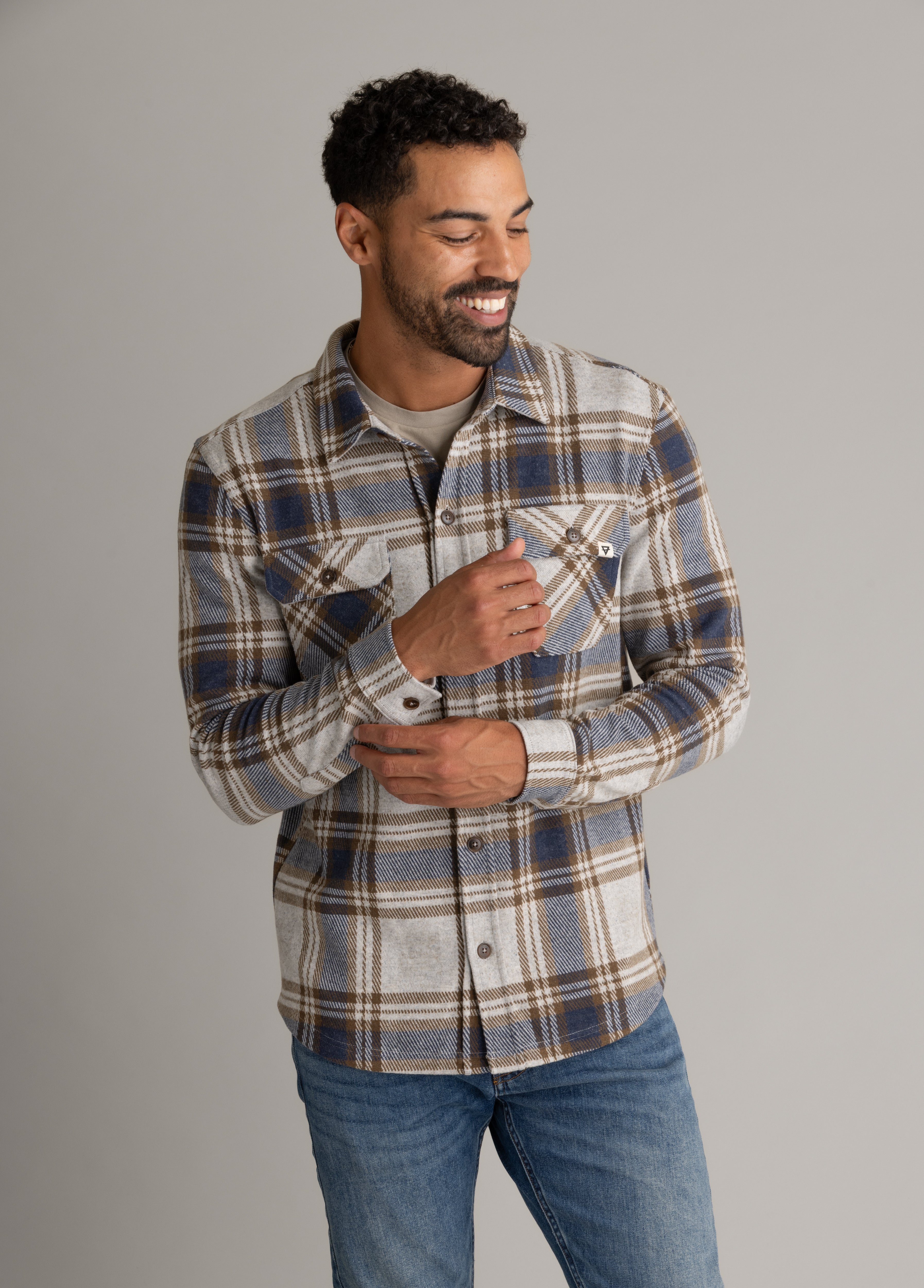 Men's LIV Outdoor Lichen Stretch Flannel button-down shirt, shown with a classic plaid pattern and relaxed fit.