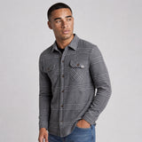 LIV Outdoor men's Lichen stretch flannel button-down shirt with a classic plaid pattern and comfortable fit.
