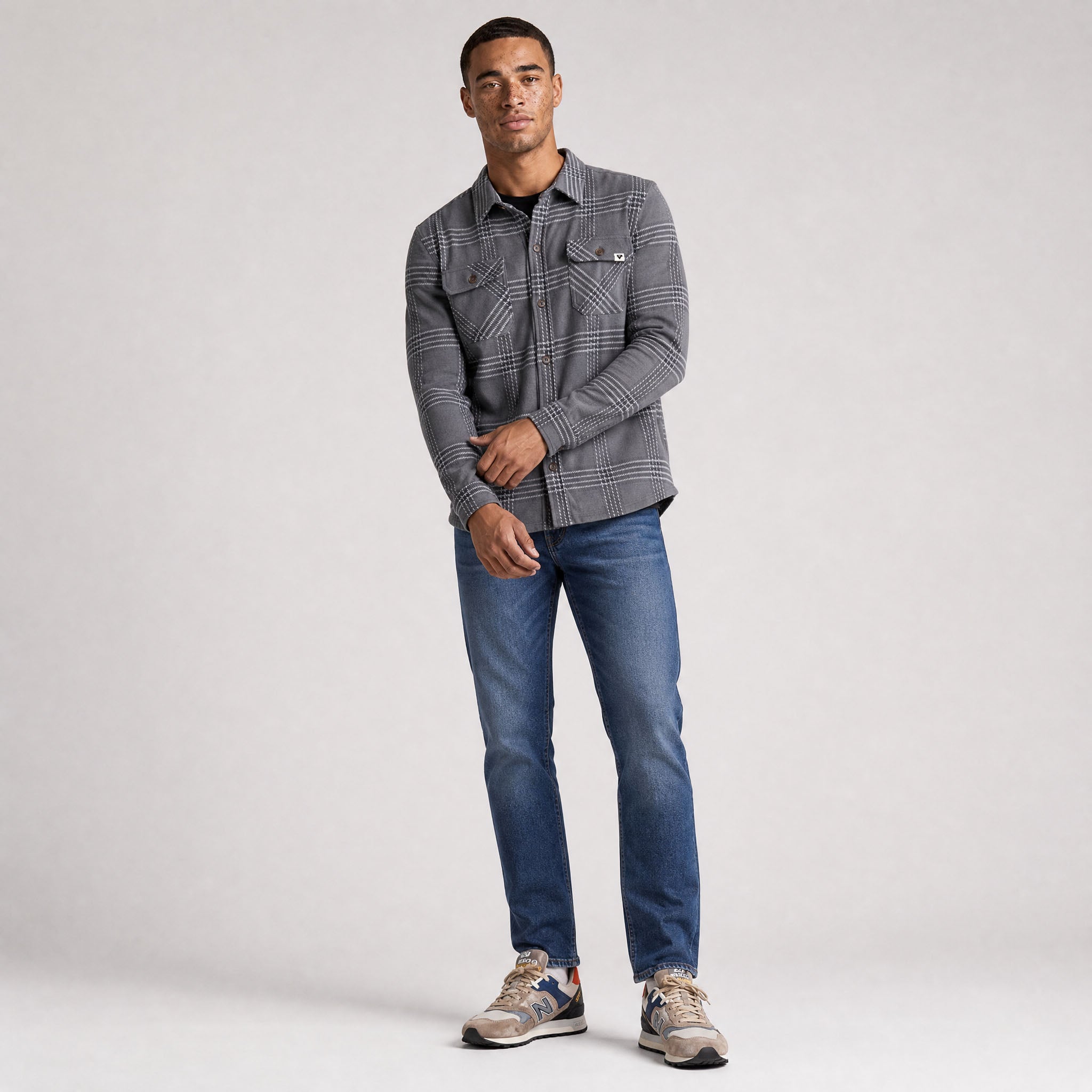 LIV Outdoor men's stretch flannel button-down shirt in lichen with a classic checkered pattern and relaxed fit.