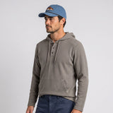 Men's LIV Outdoor Lichen stretch flannel hooded Henley top with a relaxed fit, featuring a buttoned neckline and casual hood design.