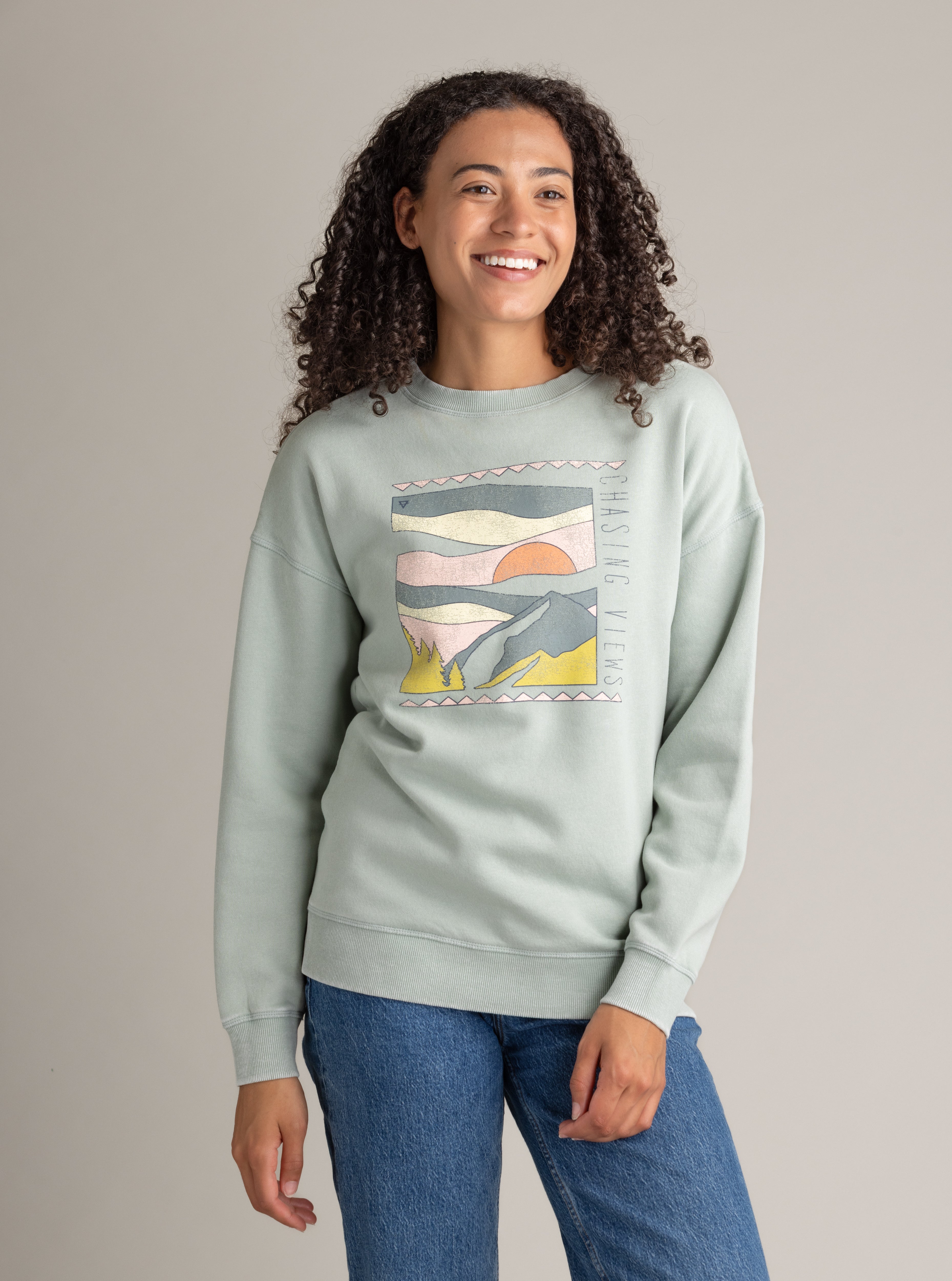 Women's LIV Outdoor oversized graphic crew sweatshirt in stonewashed aqua gray with a relaxed fit and unique design.