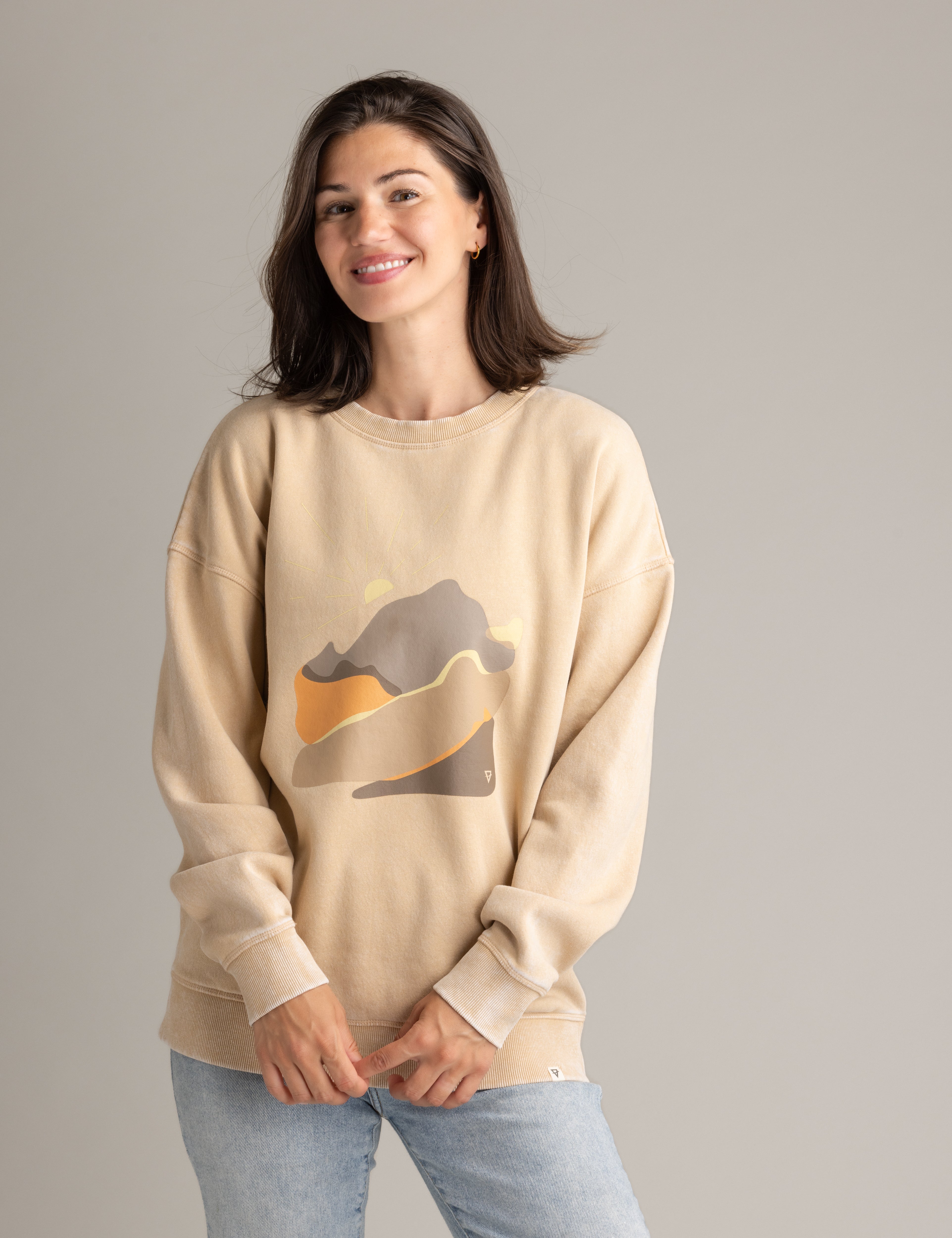 Stonewashed women's oversized graphic crew sweatshirt by LIV Outdoor featuring an abstract landscape design.