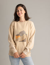 Stonewashed women's oversized graphic crew sweatshirt by LIV Outdoor featuring an abstract landscape design.