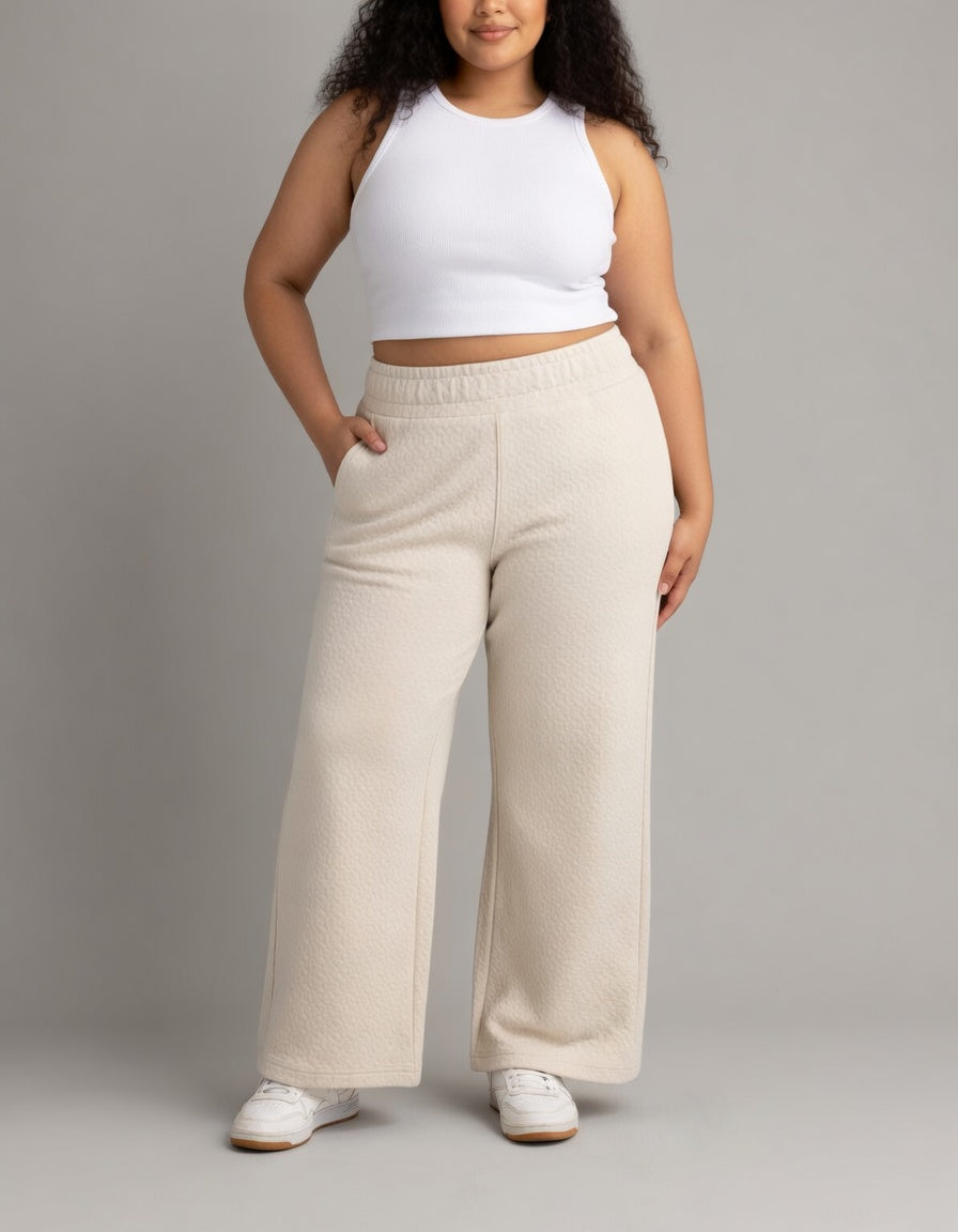 Plus women's Kaya quilted wide-leg pants by LIV Outdoor, showing the stylish, padded design and comfortable fit.