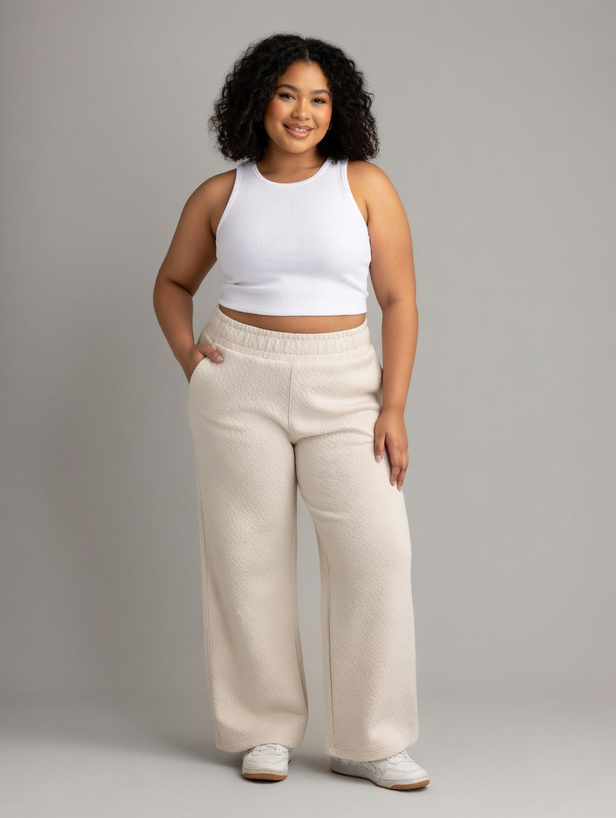 Plus women's LIV Outdoor Kaya quilted wide pant showing a relaxed fit and quilted fabric in a neutral color.