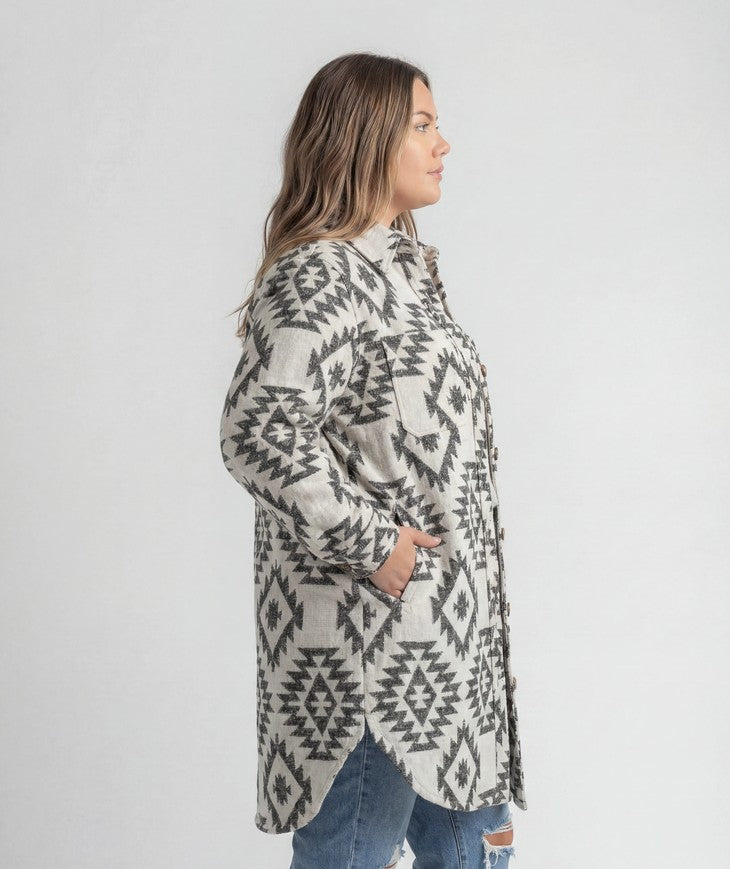 Women's LIV Outdoor Shay Plus Size Faux Wool Long Button Coat hanging on a white background, showcasing its stylish design and length.