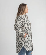 Women's LIV Outdoor Shay Plus Size Faux Wool Long Button Coat hanging on a white background, showcasing its stylish design and length.